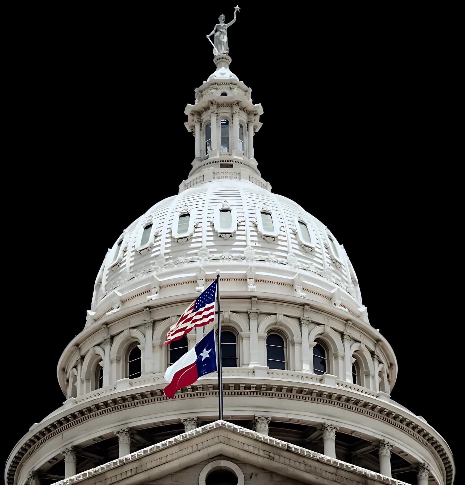 The dome of the Texas State Capitol with the U.S. and Texas flags