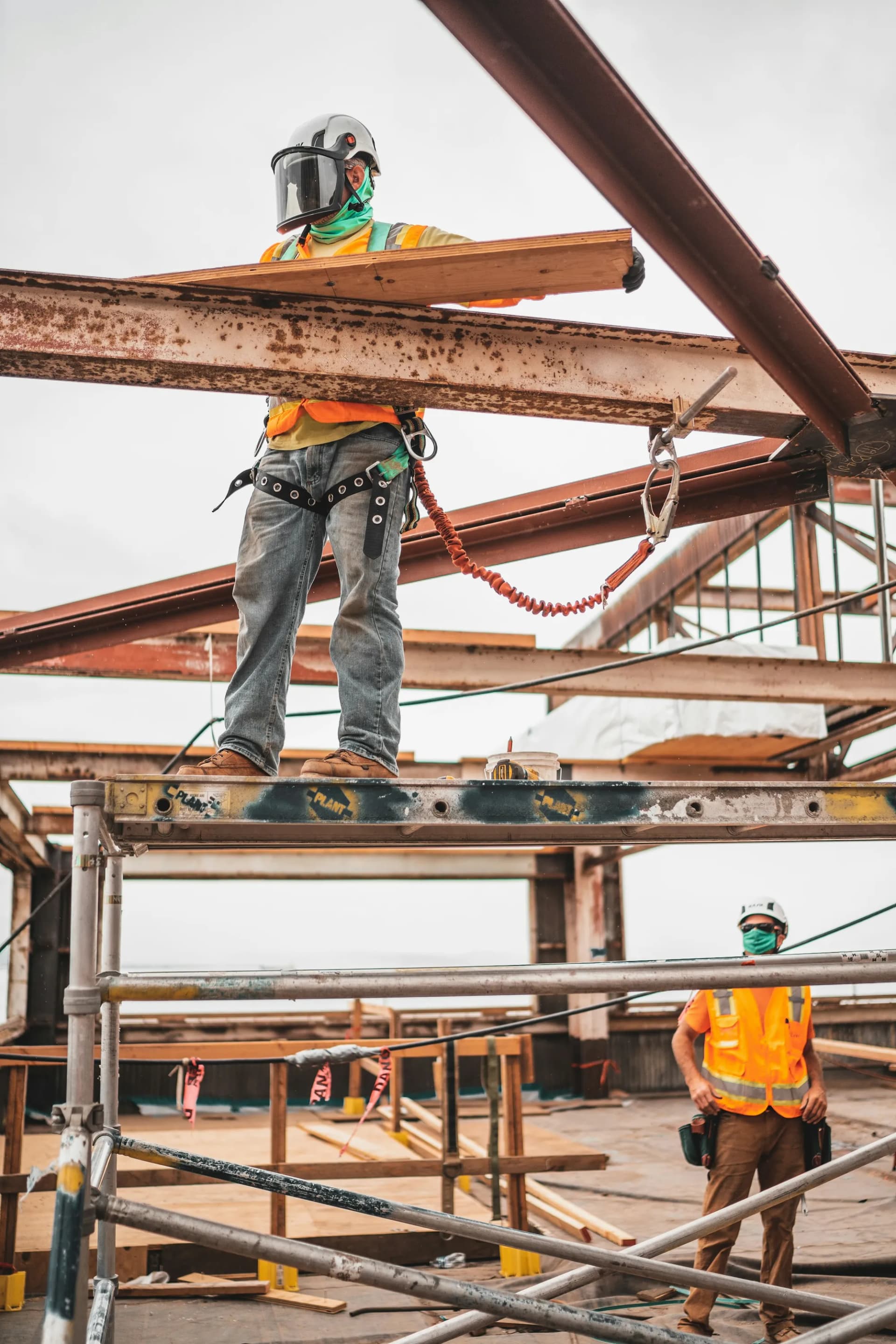Construction workers on steel scaffolding